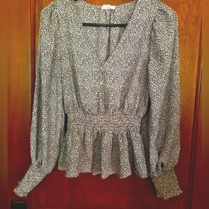 Sienna Sky Black and White polka dot pendulum blouse. Long sleeved. Size XS